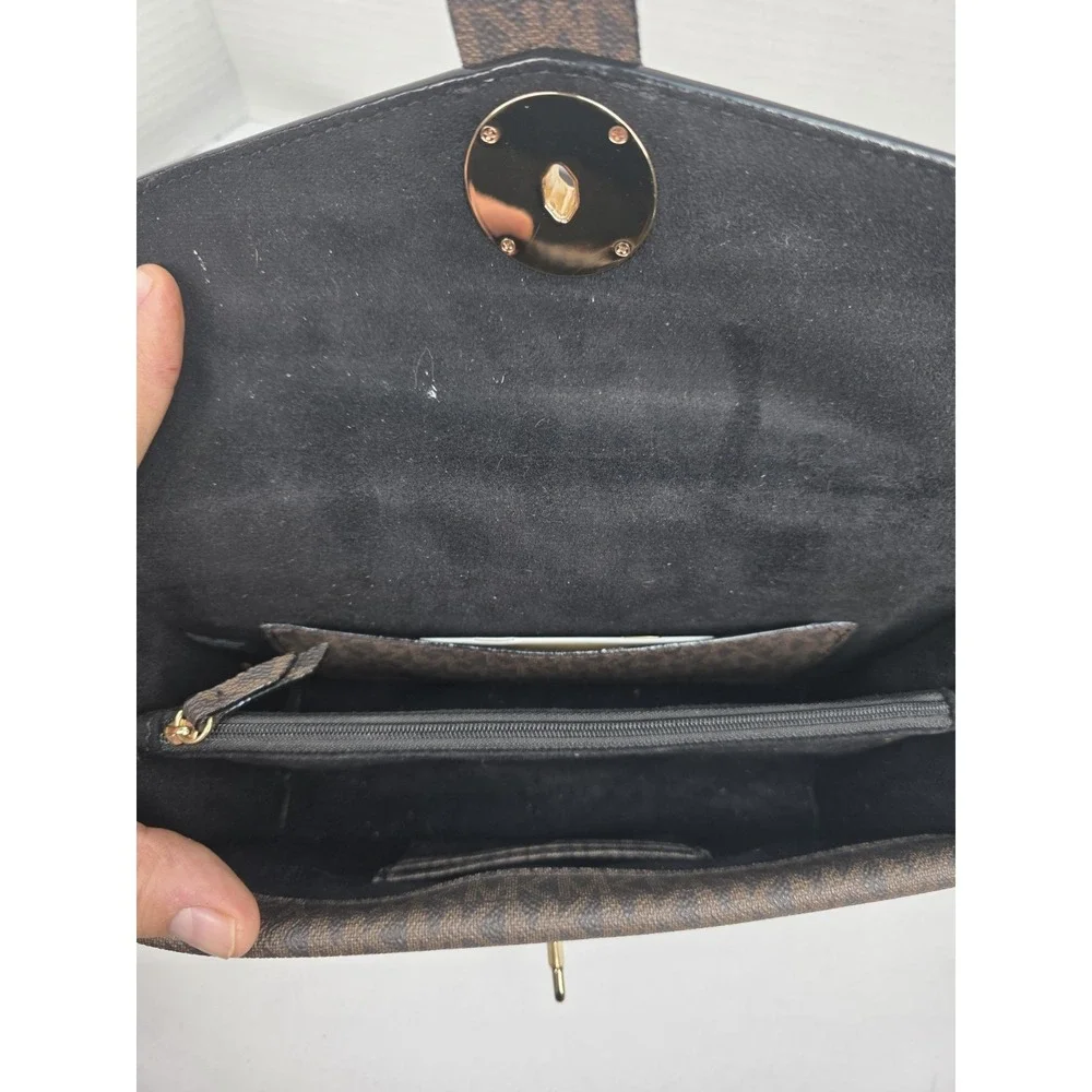 Michael Kors Greenwich medium logo-embossed patent leather shoulder bag in black